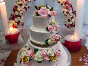 White 3 tier wedding cake with flowers