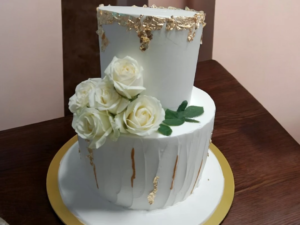 Minimalist, white, 2 tier wedding cake with flowers