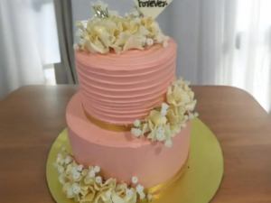 2 Tier pink wedding cake with flowers