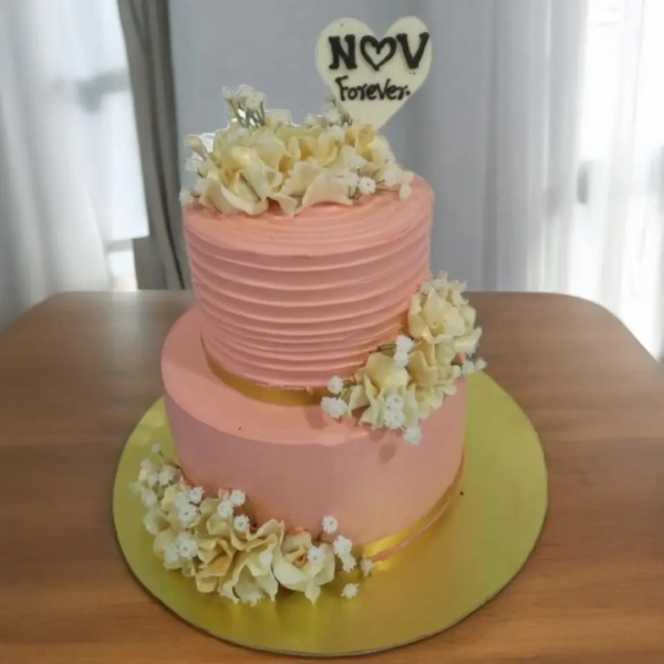 2 Tier pink wedding cake with flowers