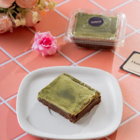 Green tea matcha brownie on white plate