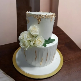 Minimalist, white, 2 tier wedding cake with flowers