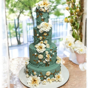 Luruxious 4 Tier Green Wedding Cake with flowers